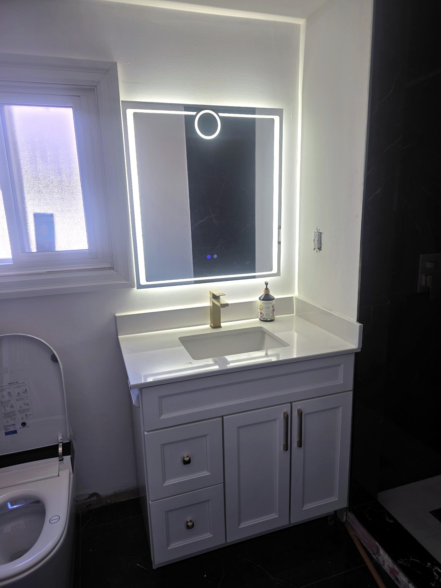 Wood vanity with backlit LED mirror